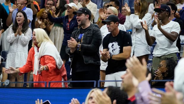 Fans including Alexis Ohanian cheer for Serena Williams, of the United States, during a match against Ajla Tomljanovic, of Australia, during the third round of the U.S. Open.